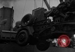 Image of Silhouettes of U.S. Army soldiers boarding a troop transport ship. Pacific Theater, 1942, second 31 stock footage video 65675071824