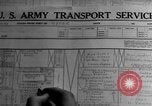 Image of Silhouettes of U.S. Army soldiers boarding a troop transport ship. Pacific Theater, 1942, second 39 stock footage video 65675071824