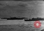 Image of Silhouettes of U.S. Army soldiers boarding a troop transport ship. Pacific Theater, 1942, second 41 stock footage video 65675071824