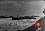 Image of Silhouettes of U.S. Army soldiers boarding a troop transport ship. Pacific Theater, 1942, second 43 stock footage video 65675071824