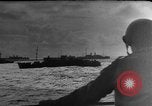 Image of Silhouettes of U.S. Army soldiers boarding a troop transport ship. Pacific Theater, 1942, second 44 stock footage video 65675071824