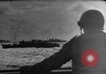 Image of Silhouettes of U.S. Army soldiers boarding a troop transport ship. Pacific Theater, 1942, second 46 stock footage video 65675071824
