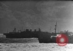 Image of Silhouettes of U.S. Army soldiers boarding a troop transport ship. Pacific Theater, 1942, second 47 stock footage video 65675071824
