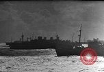 Image of Silhouettes of U.S. Army soldiers boarding a troop transport ship. Pacific Theater, 1942, second 48 stock footage video 65675071824