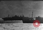 Image of Silhouettes of U.S. Army soldiers boarding a troop transport ship. Pacific Theater, 1942, second 49 stock footage video 65675071824
