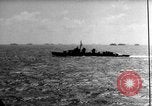 Image of Silhouettes of U.S. Army soldiers boarding a troop transport ship. Pacific Theater, 1942, second 50 stock footage video 65675071824