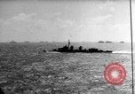 Image of Silhouettes of U.S. Army soldiers boarding a troop transport ship. Pacific Theater, 1942, second 51 stock footage video 65675071824