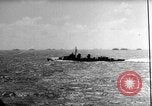 Image of Silhouettes of U.S. Army soldiers boarding a troop transport ship. Pacific Theater, 1942, second 52 stock footage video 65675071824