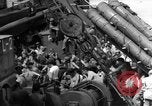 Image of Silhouettes of U.S. Army soldiers boarding a troop transport ship. Pacific Theater, 1942, second 57 stock footage video 65675071824