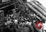 Image of Silhouettes of U.S. Army soldiers boarding a troop transport ship. Pacific Theater, 1942, second 58 stock footage video 65675071824