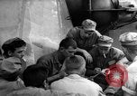 Image of Silhouettes of U.S. Army soldiers boarding a troop transport ship. Pacific Theater, 1942, second 61 stock footage video 65675071824