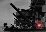 Image of Silhouettes of U.S. Army soldiers boarding a troop transport ship. Pacific Theater, 1942, second 62 stock footage video 65675071824