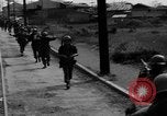 Image of Elements of the U.S. 1st Cavalry Division advancing  Manila Philippines, 1945, second 6 stock footage video 65675071952
