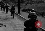 Image of Elements of the U.S. 1st Cavalry Division advancing  Manila Philippines, 1945, second 8 stock footage video 65675071952