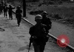 Image of Elements of the U.S. 1st Cavalry Division advancing  Manila Philippines, 1945, second 10 stock footage video 65675071952