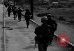 Image of Elements of the U.S. 1st Cavalry Division advancing  Manila Philippines, 1945, second 11 stock footage video 65675071952
