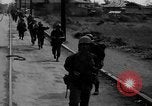 Image of Elements of the U.S. 1st Cavalry Division advancing  Manila Philippines, 1945, second 12 stock footage video 65675071952