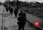 Image of Elements of the U.S. 1st Cavalry Division advancing  Manila Philippines, 1945, second 13 stock footage video 65675071952