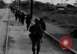 Image of Elements of the U.S. 1st Cavalry Division advancing  Manila Philippines, 1945, second 15 stock footage video 65675071952