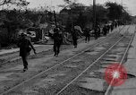 Image of Elements of the U.S. 1st Cavalry Division advancing  Manila Philippines, 1945, second 16 stock footage video 65675071952