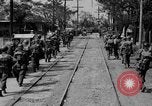 Image of Elements of the U.S. 1st Cavalry Division advancing  Manila Philippines, 1945, second 28 stock footage video 65675071952