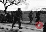 Image of Elements of the U.S. 1st Cavalry Division advancing  Manila Philippines, 1945, second 52 stock footage video 65675071952