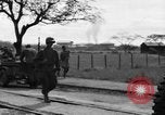 Image of Elements of the U.S. 1st Cavalry Division advancing  Manila Philippines, 1945, second 59 stock footage video 65675071952