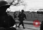 Image of Elements of the U.S. 1st Cavalry Division advancing  Manila Philippines, 1945, second 60 stock footage video 65675071952