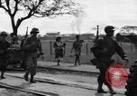 Image of Elements of the U.S. 1st Cavalry Division advancing  Manila Philippines, 1945, second 61 stock footage video 65675071952