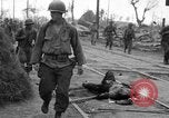 Image of General Mudge and troops of U.S. 1st Cavalry Division Manila Philippines, 1945, second 22 stock footage video 65675071953