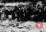 Image of mass burial Ukraine, 1944, second 20 stock footage video 65675071994