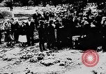 Image of mass burial Ukraine, 1944, second 21 stock footage video 65675071994