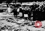Image of mass burial Ukraine, 1944, second 24 stock footage video 65675071994