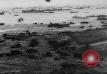 Image of Normandy beachhead filled with reinforcement troops and equipment France, 1944, second 8 stock footage video 65675072013