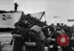 Image of Normandy beachhead filled with reinforcement troops and equipment France, 1944, second 21 stock footage video 65675072013