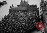 Image of Normandy beachhead filled with reinforcement troops and equipment France, 1944, second 36 stock footage video 65675072013