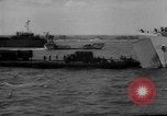 Image of Normandy beachhead filled with reinforcement troops and equipment France, 1944, second 45 stock footage video 65675072013