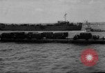 Image of Normandy beachhead filled with reinforcement troops and equipment France, 1944, second 50 stock footage video 65675072013