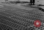 Image of Normandy beachhead filled with reinforcement troops and equipment France, 1944, second 54 stock footage video 65675072013
