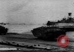 Image of Normandy beachhead filled with reinforcement troops and equipment France, 1944, second 57 stock footage video 65675072013