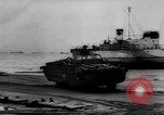 Image of Normandy beachhead filled with reinforcement troops and equipment France, 1944, second 58 stock footage video 65675072013
