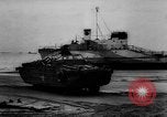 Image of Normandy beachhead filled with reinforcement troops and equipment France, 1944, second 59 stock footage video 65675072013