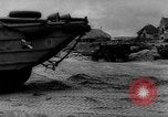Image of Normandy beachhead filled with reinforcement troops and equipment France, 1944, second 60 stock footage video 65675072013