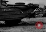 Image of Normandy beachhead filled with reinforcement troops and equipment France, 1944, second 61 stock footage video 65675072013
