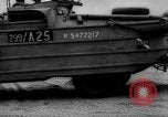 Image of Normandy beachhead filled with reinforcement troops and equipment France, 1944, second 62 stock footage video 65675072013