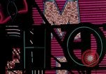 Image of neon signs of casinos and motels Las Vegas Nevada USA, 1958, second 20 stock footage video 65675072077