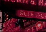 Image of neon signs of casinos and motels Las Vegas Nevada USA, 1958, second 23 stock footage video 65675072077