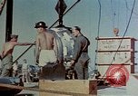 Image of Hoisting of Gadget atomic bomb before Trinity nuclear test Alamogordo New Mexico USA, 1945, second 30 stock footage video 65675072463