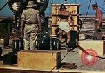 Image of Hoisting of Gadget atomic bomb before Trinity nuclear test Alamogordo New Mexico USA, 1945, second 59 stock footage video 65675072463