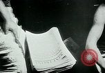 Image of German propaganda newspaper printing World War 2 Paris France, 1940, second 58 stock footage video 65675072693